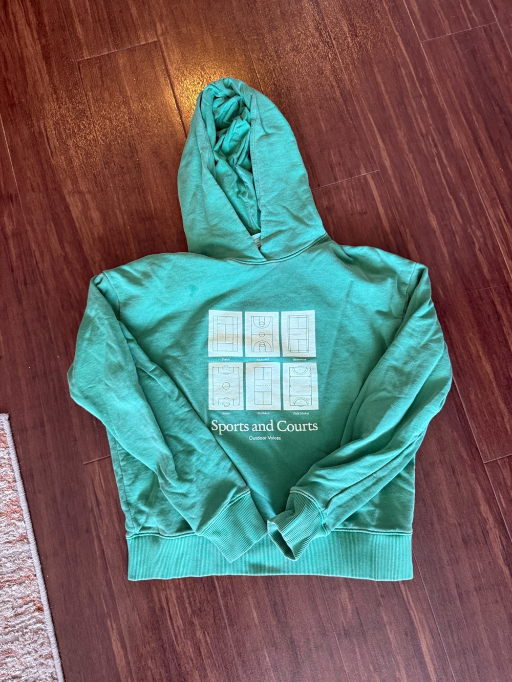 Outdoor Voice graphic “Sports and Courts” hoodie in size S